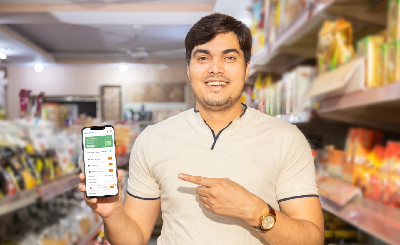 General trade store owner using the BeatRoute app in front of a fully stocked counter.