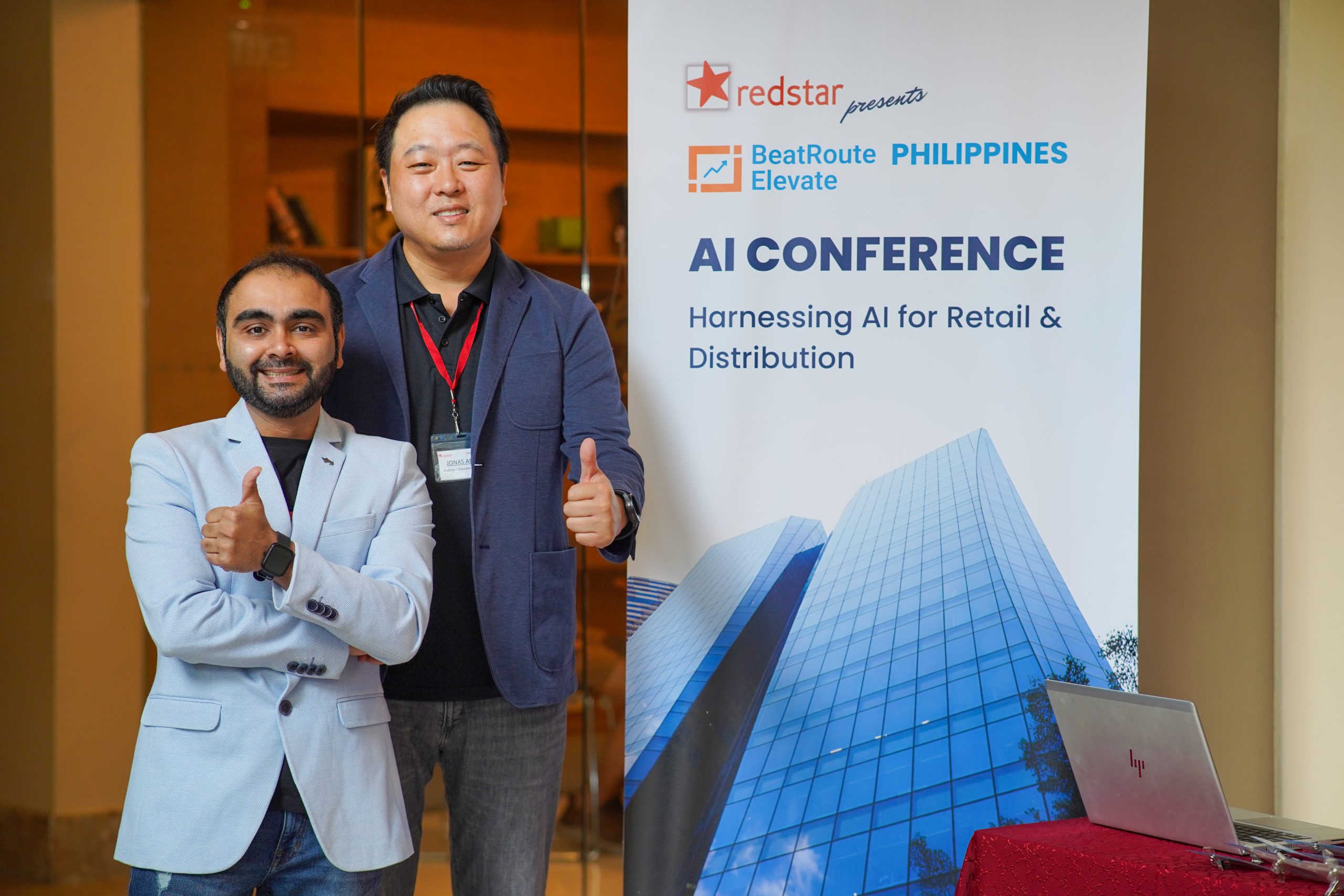 BeatRoute Elevate Manila AI conference: Two men give thumbs up.